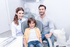 family of three at the dentist