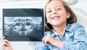 Young girl holding panoramic x-ray