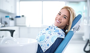 Smiling woman sitting in dental office