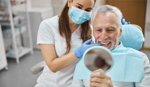 a patient smiling about his dental implants in Wichita Falls