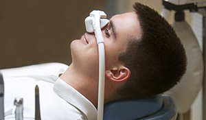 teenager wearing a mask that’s administering nitrous oxide sedation