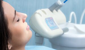 Woman with eyes closed in dental chair