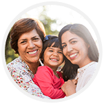 Two woman and child smiling brightly