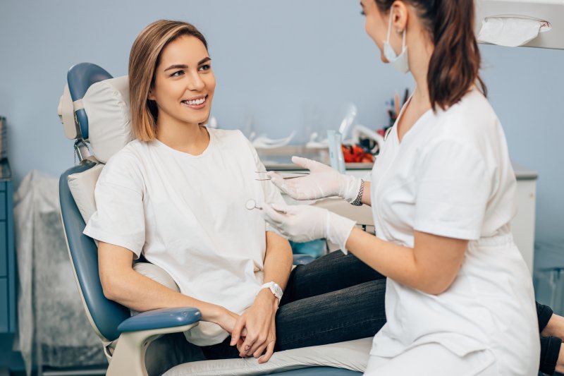 woman speaking with dentist about fluoride in Wichita Falls