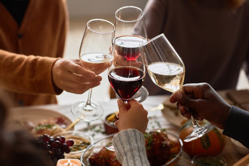 Friends gathering to drink wine while being aware of dental wine stains