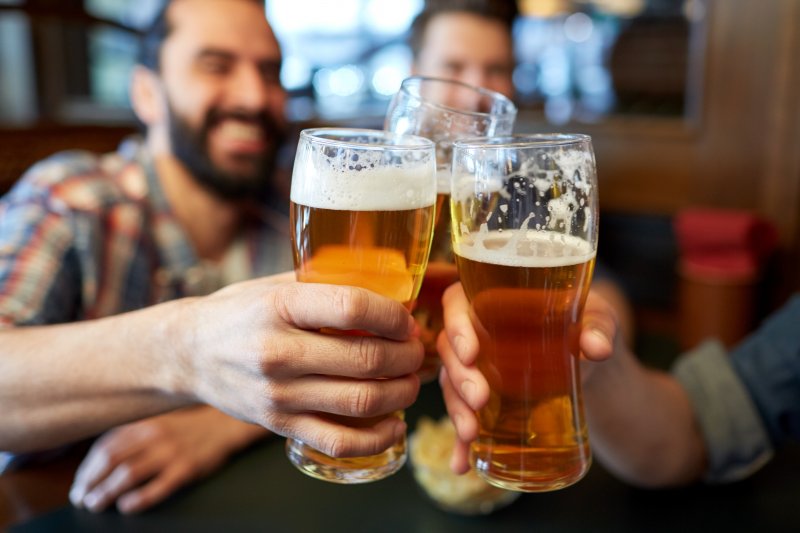 Men drinking beer together