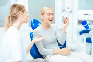 woman with cosmetic dentist in Wichita Falls